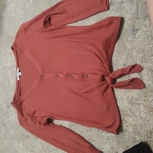 redish orange v neck button down sweater with tue